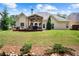 A well-manicured backyard features a deck and gazebo perfect for outdoor enjoyment and entertaining guests at 492 Thorn Creek Way, Dallas, GA 30157