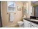 Clean bathroom with toilet, shower, vanity and granite countertop with modern fixtures at 492 Thorn Creek Way, Dallas, GA 30157