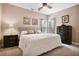 Cozy bedroom with a large bed, dresser, and natural light, providing a comfortable and inviting space at 492 Thorn Creek Way, Dallas, GA 30157