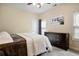 Cozy bedroom featuring carpet, a dresser, and a queen-size bed with white comforter and decor at 492 Thorn Creek Way, Dallas, GA 30157