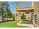 Outdoor view of an upper level deck with backyard and patio below at 9183 Golfview Cir, Covington, GA 30014
