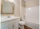 Clean bathroom with white vanity, framed mirror, and a shower-tub combination at 9183 Golfview Cir, Covington, GA 30014