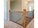 Second story hallway with wooden railing at 9183 Golfview Cir, Covington, GA 30014