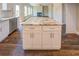 Kitchen island featuring white cabinets, granite countertops with stainless steel appliances at 9183 Golfview Cir, Covington, GA 30014
