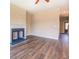 Cozy living room featuring a fireplace and beautiful hardwood floors at 9183 Golfview Cir, Covington, GA 30014