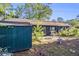 Backyard features a storage shed, small patio area, and lush greenery, offering a private outdoor space at 161 Aaron Ct, Riverdale, GA 30274