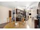 Charming kitchen area with dark wood cabinets, tiled backsplash, and stainless steel appliances, perfect for cooking at 161 Aaron Ct, Riverdale, GA 30274