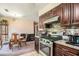 Well-equipped kitchen featuring stainless steel appliances, granite countertops, and ample cabinet space at 161 Aaron Ct, Riverdale, GA 30274