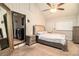 Comfortable main bedroom with a plush bed, side table, and view into the laundry room at 161 Aaron Ct, Riverdale, GA 30274