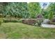 Expansive backyard with lush green lawn, surrounded by mature trees and well-maintained landscaping at 3007 Frazier Ct, Decatur, GA 30033