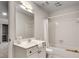 Bright bathroom featuring a white vanity, a large mirror, and a shower-tub combination with white tile at 3007 Frazier Ct, Decatur, GA 30033