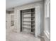 Spacious bedroom featuring a large, built-in shelving unit, neutral paint, and carpet at 3007 Frazier Ct, Decatur, GA 30033
