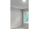 Bedroom closet with bi-fold doors and window for natural light at 3007 Frazier Ct, Decatur, GA 30033
