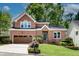 Charming two-story brick home with a well-manicured lawn and a two-car garage at 3007 Frazier Ct, Decatur, GA 30033