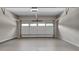 Clean, empty garage with a white door and overhead lighting, ready for parking and storage at 3007 Frazier Ct, Decatur, GA 30033