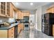 This kitchen features stainless appliances, wood cabinetry, hard surface countertops, and stunning tile flooring at 3007 Frazier Ct, Decatur, GA 30033
