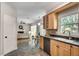 Kitchen boasts wood cabinets, stainless appliances, hard surface countertops, and an eat-in area with backyard views at 3007 Frazier Ct, Decatur, GA 30033