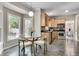Eat-in kitchen features stainless appliances, wood cabinets, and large windows offering natural light and backyard views at 3007 Frazier Ct, Decatur, GA 30033