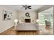 Living room features hardwood floors, fireplace, fan, neutral colors and access to sunroom at 3007 Frazier Ct, Decatur, GA 30033