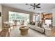 Open living space featuring hardwood flooring, fireplace, and sunroom access for seamless indoor-outdoor living at 3007 Frazier Ct, Decatur, GA 30033