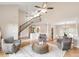 Open-concept living space with hardwood floors and a staircase with iron railings at 3007 Frazier Ct, Decatur, GA 30033