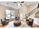 Bright living room featuring vaulted ceilings, hardwood floors, and large windows at 3007 Frazier Ct, Decatur, GA 30033