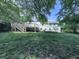 Home featuring a wooden deck offering outdoor space and access to the spacious backyard at 3163 Old 41 Nw Hwy, Kennesaw, GA 30144