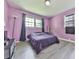 Bright bedroom features wood-look flooring, natural light from two windows, and neutral decor at 3163 Old 41 Nw Hwy, Kennesaw, GA 30144