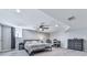 A bedroom features a ceiling fan, a window, and gray laminate flooring at 3163 Old 41 Nw Hwy, Kennesaw, GA 30144