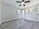 Empty bedroom features wood-look flooring, natural light from two windows, and neutral paint at 3163 Old 41 Nw Hwy, Kennesaw, GA 30144
