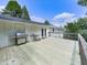 Expansive wooden deck with barbecue grill and outdoor seating area at 3163 Old 41 Nw Hwy, Kennesaw, GA 30144
