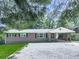 Charming brick home featuring a covered carport and a low maintenance gravel yard at 3163 Old 41 Nw Hwy, Kennesaw, GA 30144