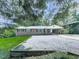 Charming brick home featuring a covered carport and a low maintenance gravel yard at 3163 Old 41 Nw Hwy, Kennesaw, GA 30144