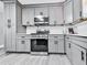 Well-equipped kitchen featuring gray cabinets, stainless steel appliances, and plenty of storage at 3163 Old 41 Nw Hwy, Kennesaw, GA 30144