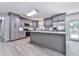 Modern kitchen features a central island, gray cabinetry, and stainless appliances at 3163 Old 41 Nw Hwy, Kennesaw, GA 30144
