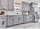 Charming kitchen with gray cabinets, stainless steel appliances, and a window for natural light at 3163 Old 41 Nw Hwy, Kennesaw, GA 30144