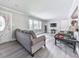 Cozy living room with modern flooring, neutral paint, and front door access at 3163 Old 41 Nw Hwy, Kennesaw, GA 30144