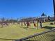 A large playground with swings and climbing structures at 3163 Old 41 Nw Hwy, Kennesaw, GA 30144