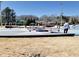 Outdoor skate park with ramps and rails, picnic tables and umbrellas in the background at 3163 Old 41 Nw Hwy, Kennesaw, GA 30144