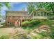 Multi-level back exterior with deck, screened porch, and stone pathway at 3999 Saint Clair Ne Ct, Brookhaven, GA 30319