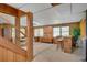Finished basement featuring wooden stairs, paneling, and a custom bar perfect for entertaining guests at 3999 Saint Clair Ne Ct, Brookhaven, GA 30319