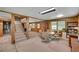 Spacious basement with stairs, wood paneling, and large windows that offer ample natural light at 3999 Saint Clair Ne Ct, Brookhaven, GA 30319