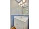 A well-lit half bath with vanity and overhead lighting at 3999 Saint Clair Ne Ct, Brookhaven, GA 30319