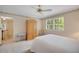 Bedroom with a window letting in natural light, complemented by a ceiling fan for added comfort at 3999 Saint Clair Ne Ct, Brookhaven, GA 30319