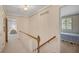 Hallway with views of a bedroom and sitting area that showcases the seamless flow of the home's design at 3999 Saint Clair Ne Ct, Brookhaven, GA 30319