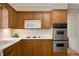 A closer view of the kitchen featuring wood cabinets and modern stainless steel appliances at 3999 Saint Clair Ne Ct, Brookhaven, GA 30319