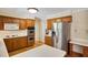 A well-lit kitchen with stainless steel appliances, including a refrigerator and double oven at 3999 Saint Clair Ne Ct, Brookhaven, GA 30319