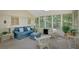 The sunroom features multiple windows, a ceiling fan and lots of natural light at 3999 Saint Clair Ne Ct, Brookhaven, GA 30319
