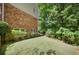 Backyard with lush lawn and mature trees providing shade at 3999 Saint Clair Ne Ct, Brookhaven, GA 30319