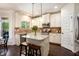 Stylish kitchen with granite countertops, stainless steel appliances, and a central island at 6140 Stillwood Ln, Cumming, GA 30041
